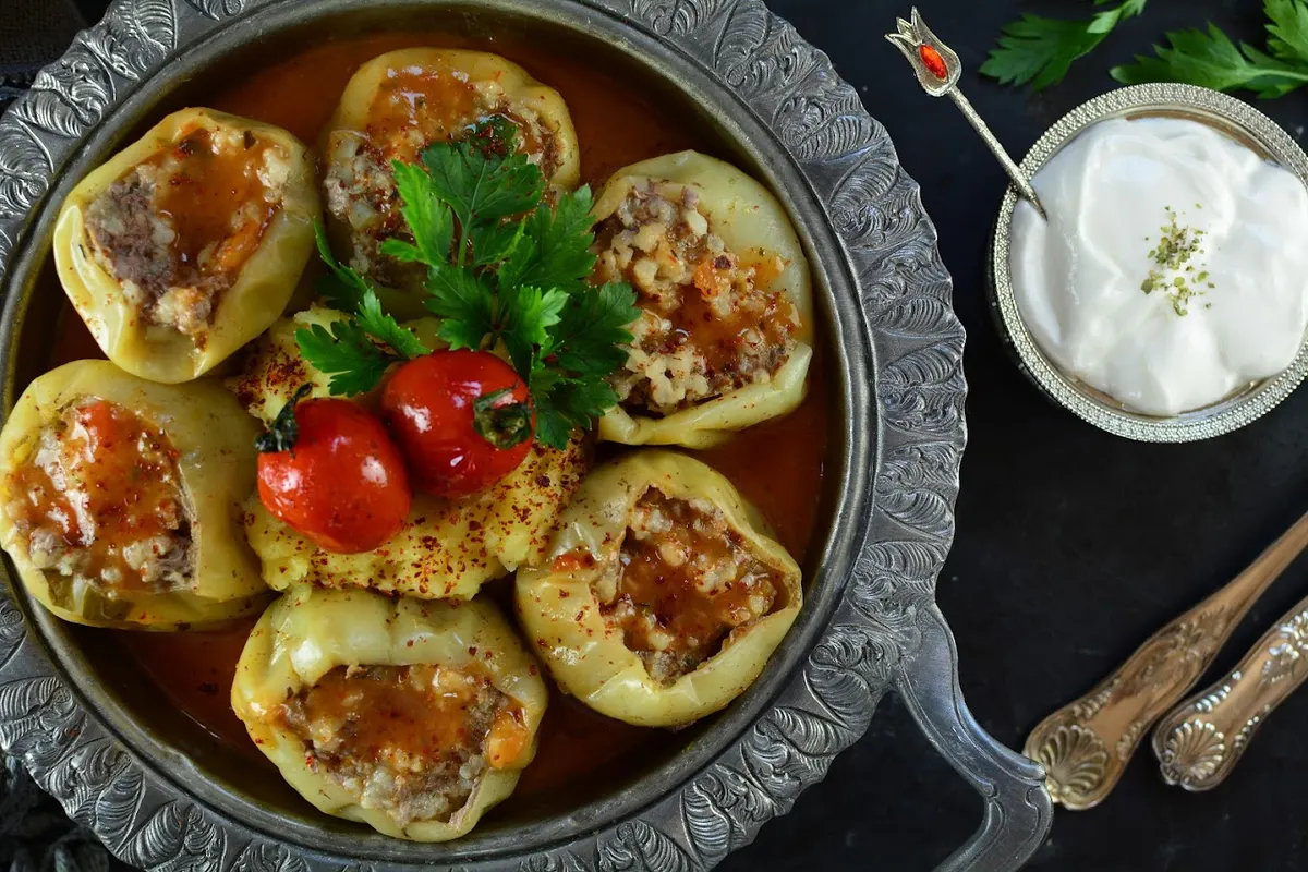 Traditional Bosnian dolma — stuffed peppers in a copper tray